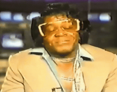Man In Sunglasses And Suit Watching TV GIF