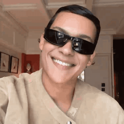 Man In Sunglasses And Tan Shirt Smiling GIF