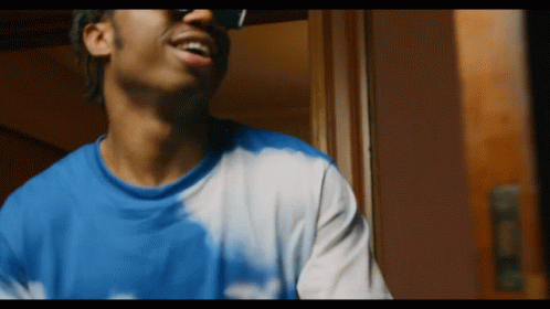 Man In Sunglasses And Tie Dye Shirt GIF