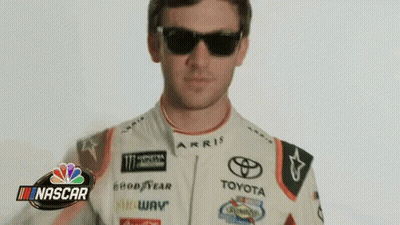 Man In Sunglasses And Toyota Racing Suit In Front Of NASCAR Logo GIF