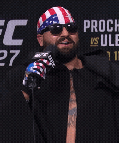Man In Sunglasses And UFC Bandana In Front Of Microphone GIF