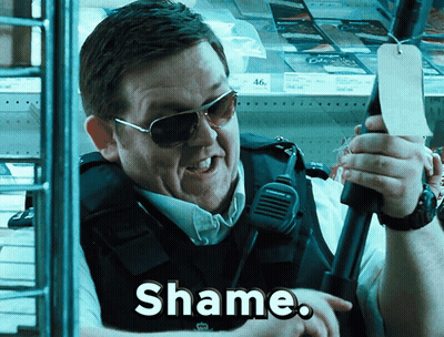 Man In Sunglasses And Vest Holding Microphone Saying Shame GIF