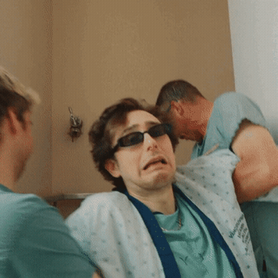 Man in Sunglasses and Virginia Memorial Hospital Gown
