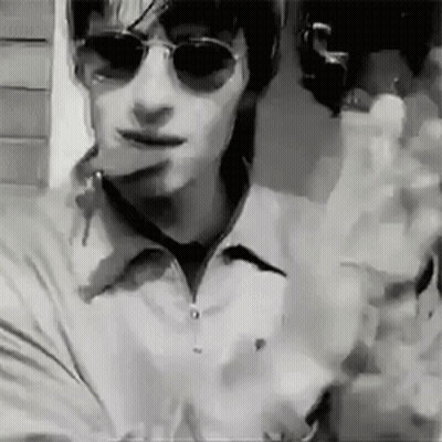 Man In Sunglasses And White Shirt Smoking Cigarette GIF