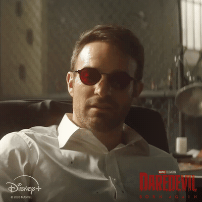 Man In Sunglasses And White Shirt With Daredevil Poster GIF