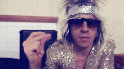 Man In Sunglasses And Wig Making Funny Face GIF