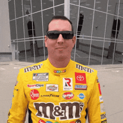 Man In Sunglasses And Yellow M&M's Shirt GIF