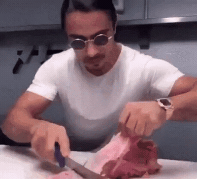 Man In Sunglasses Cutting Meat GIF