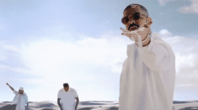 Man In Sunglasses Dancing In Desert GIF