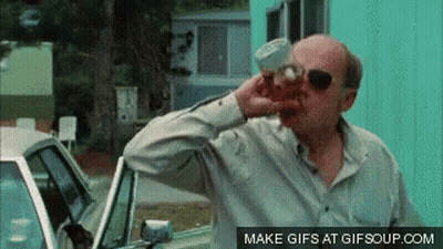 Man In Sunglasses Drinking From Cup Beside Car GIF