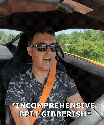Man In Sunglasses Driving Car Saying Incomplete Brit Gibberish GIF