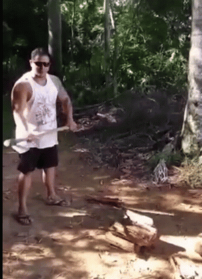 Man In Sunglasses Holding Axe In Dirt GIF