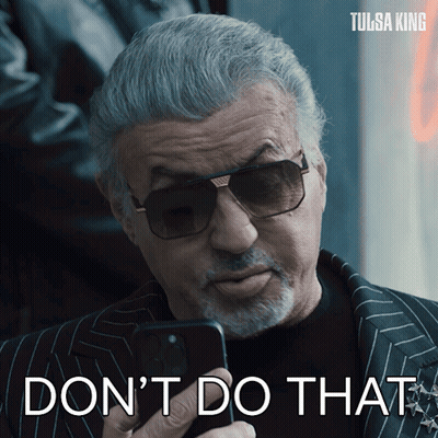 Man in Sunglasses Holding Cell Phone Saying Don't Do That