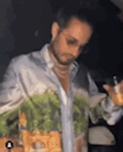 Man In Sunglasses Holding Drink And Cell Phone GIF