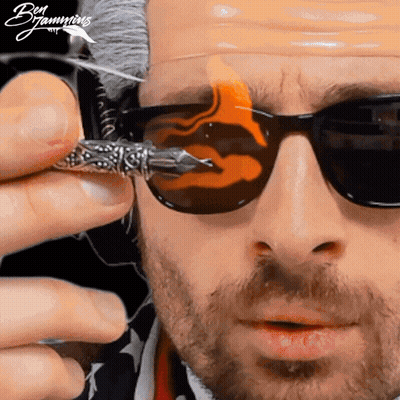 Man In Sunglasses Holding Flame Pen GIF
