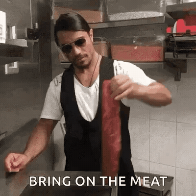 Man In Sunglasses Holding Meat GIF