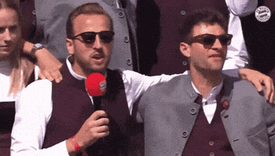 Man In Sunglasses Holding Microphone GIF