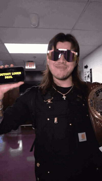 Man In Sunglasses Holding Phone Saying Outout Logan Paul GIF