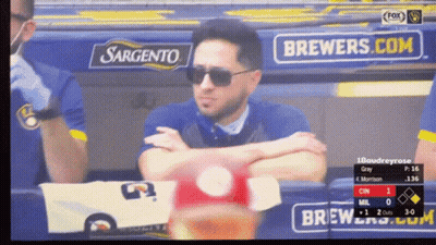 Man In Sunglasses In Dugout With Brewers.com Ad GIF