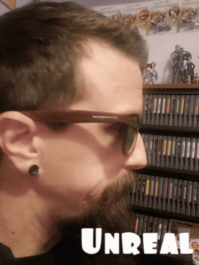 Man In Sunglasses In Front Of Bookshelf Unreal GIF
