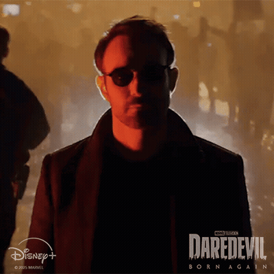 Man In Sunglasses In Front Of Daredevil Born Again Poster GIF