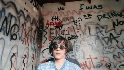 Man In Sunglasses In Front Of Graffiti Saying No I Was Drinking GIF