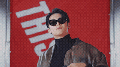 Man In Sunglasses Leather Jacket With Sign This GIF