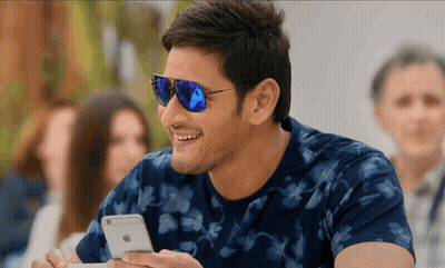 Man In Sunglasses Looking At Phone GIF