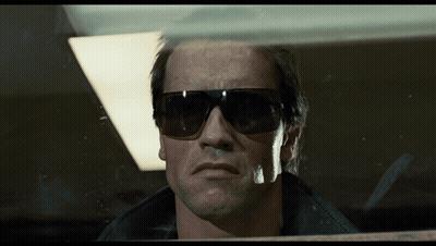 Man In Sunglasses Looking Through Window GIF