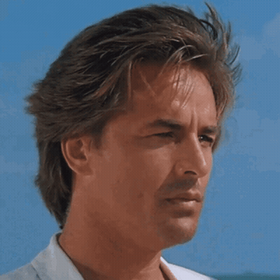 Man In Sunglasses Looking To Side With Blue Sky GIF