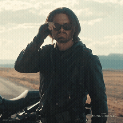 Man In Sunglasses Next To Motorcycle And Thunderbolts Logo GIF