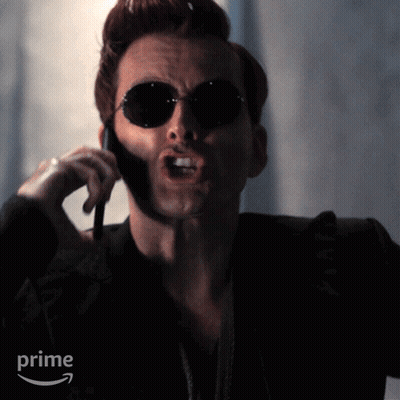 Man In Sunglasses On Cell Phone With Prime Logo GIF