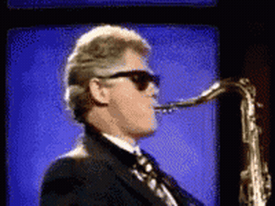 Man In Sunglasses Playing Saxophone GIF