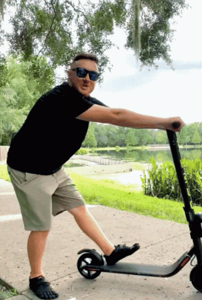 Man In Sunglasses Pushing Scooter GIF