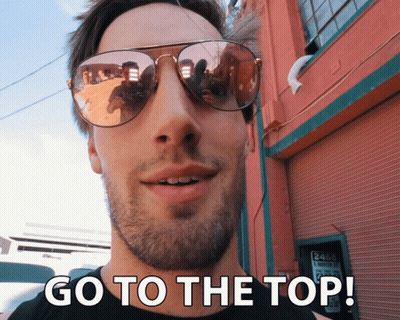 Man In Sunglasses Saying Go To The Top GIF