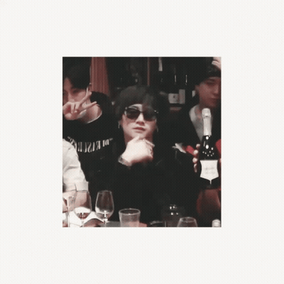 Man In Sunglasses Sitting At Table With Champagne GIF