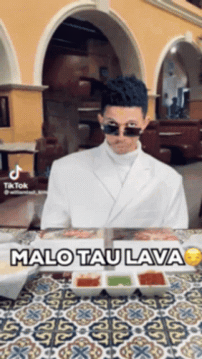 Man In Sunglasses Sitting At Table With Food Malo Tau Lava GIF
