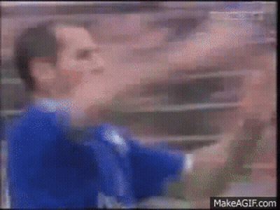 Man In Sunglasses Sitting At Table With Hands In Air GIF