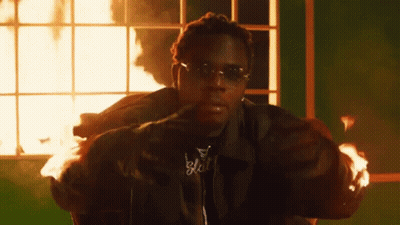Man In Sunglasses Sitting Before Window Fire GIF