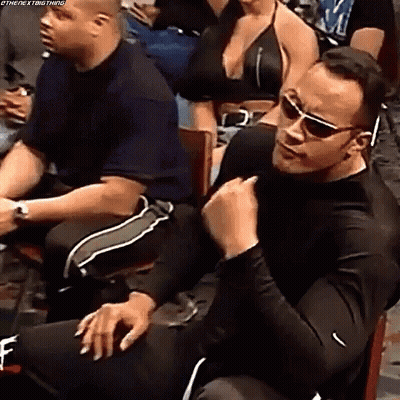 Man In Sunglasses Sitting In Chair Before Crowd GIF