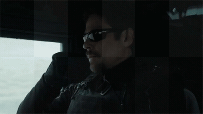 Man In Sunglasses Sitting In Dark Room GIF