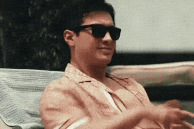 Man In Sunglasses Sitting On Chair GIF