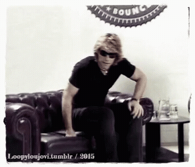 Man In Sunglasses Sitting On Couch GIF