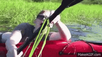 Man In Sunglasses Sitting On Red Raft GIF