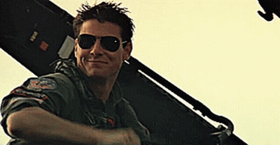 Man In Sunglasses Smiling In Front Of Plane GIF