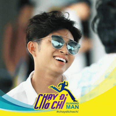 Man In Sunglasses Smiling In Front Of Running Man Ad GIF