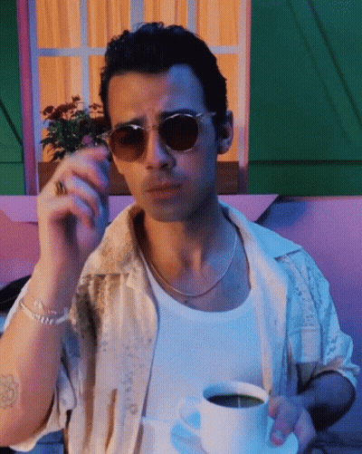Man In Sunglasses Smoking Cigarette Holding Coffee GIF