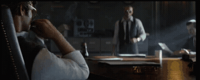 Man In Sunglasses Smoking Cigarette In Chair GIF