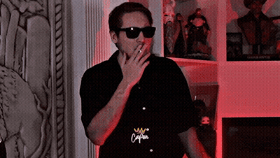 Man In Sunglasses Smoking Cigarette Shirt Says Caliban GIF