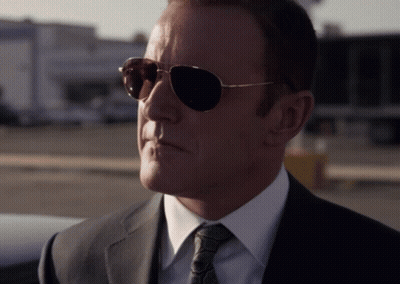 Man In Sunglasses, Suit, And Tie GIF
